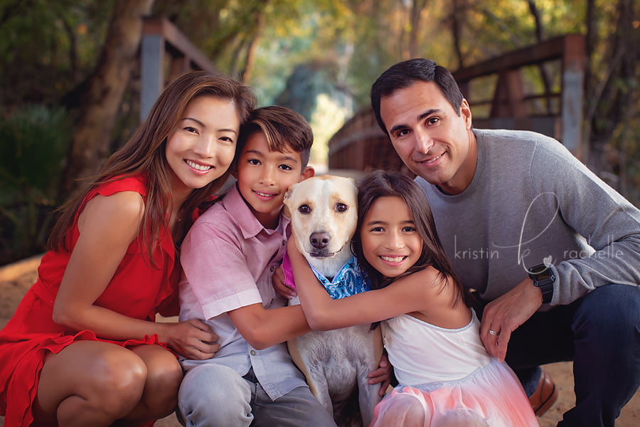 close up shot of family with dog