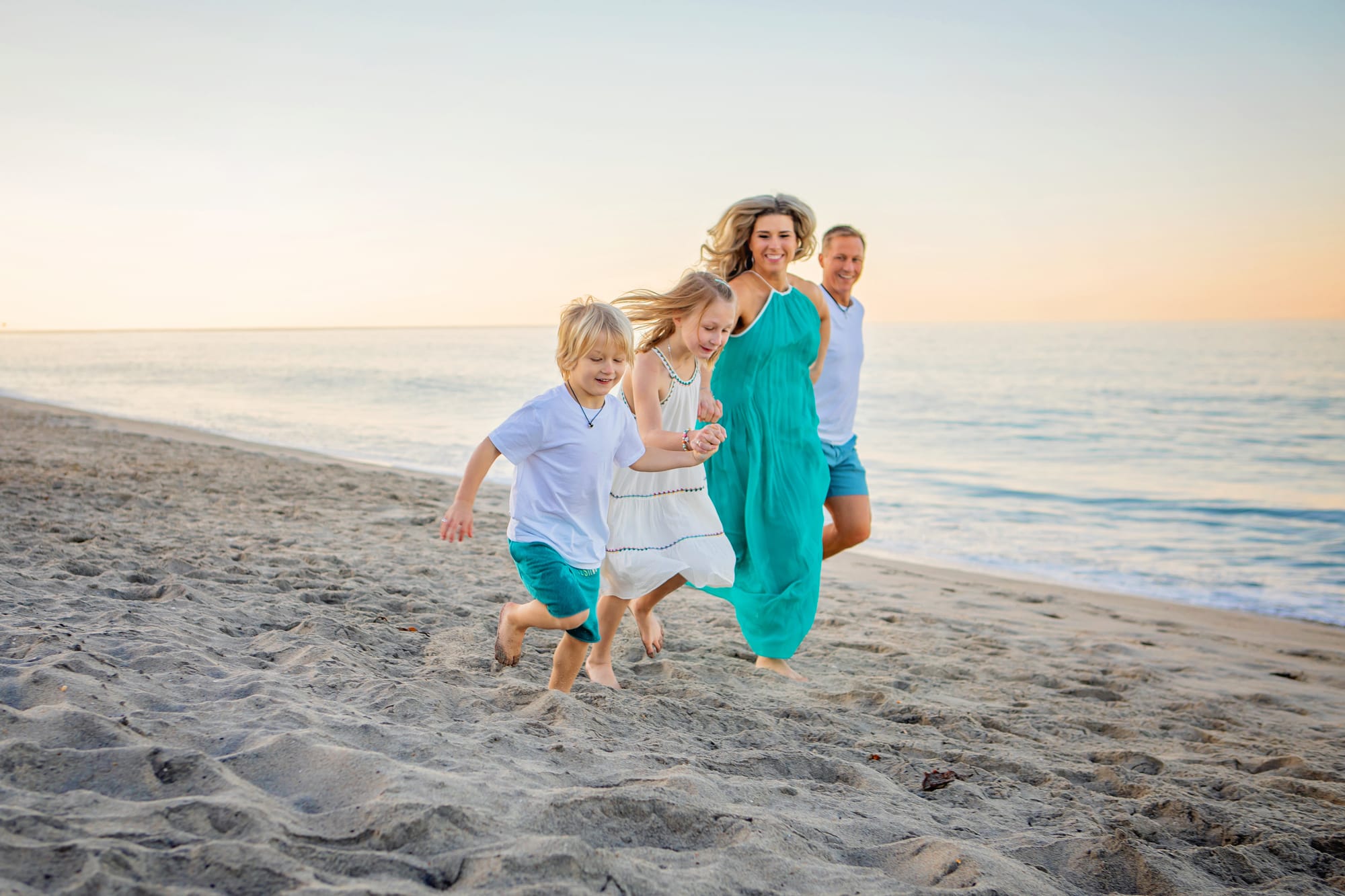 Carlsbad, San Diego Beach Photographers with family of four at sunrise