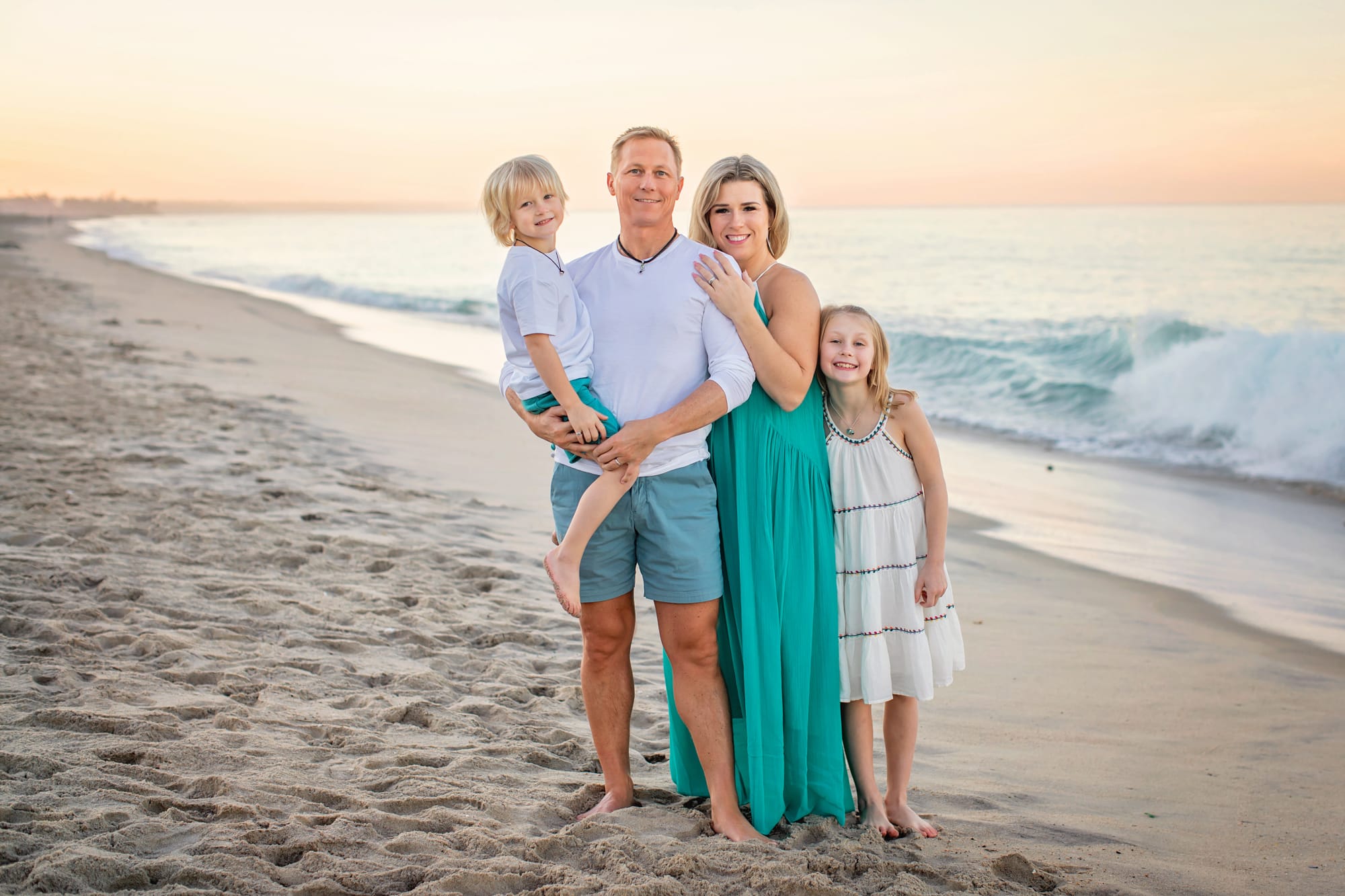 Beach Family Photography with family of four at sunrise
