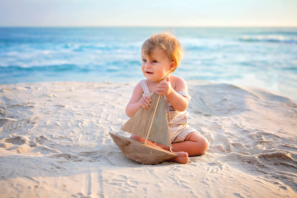 Photography by Vacation Photographer San Diego. Photo is of one baby outdoors.
