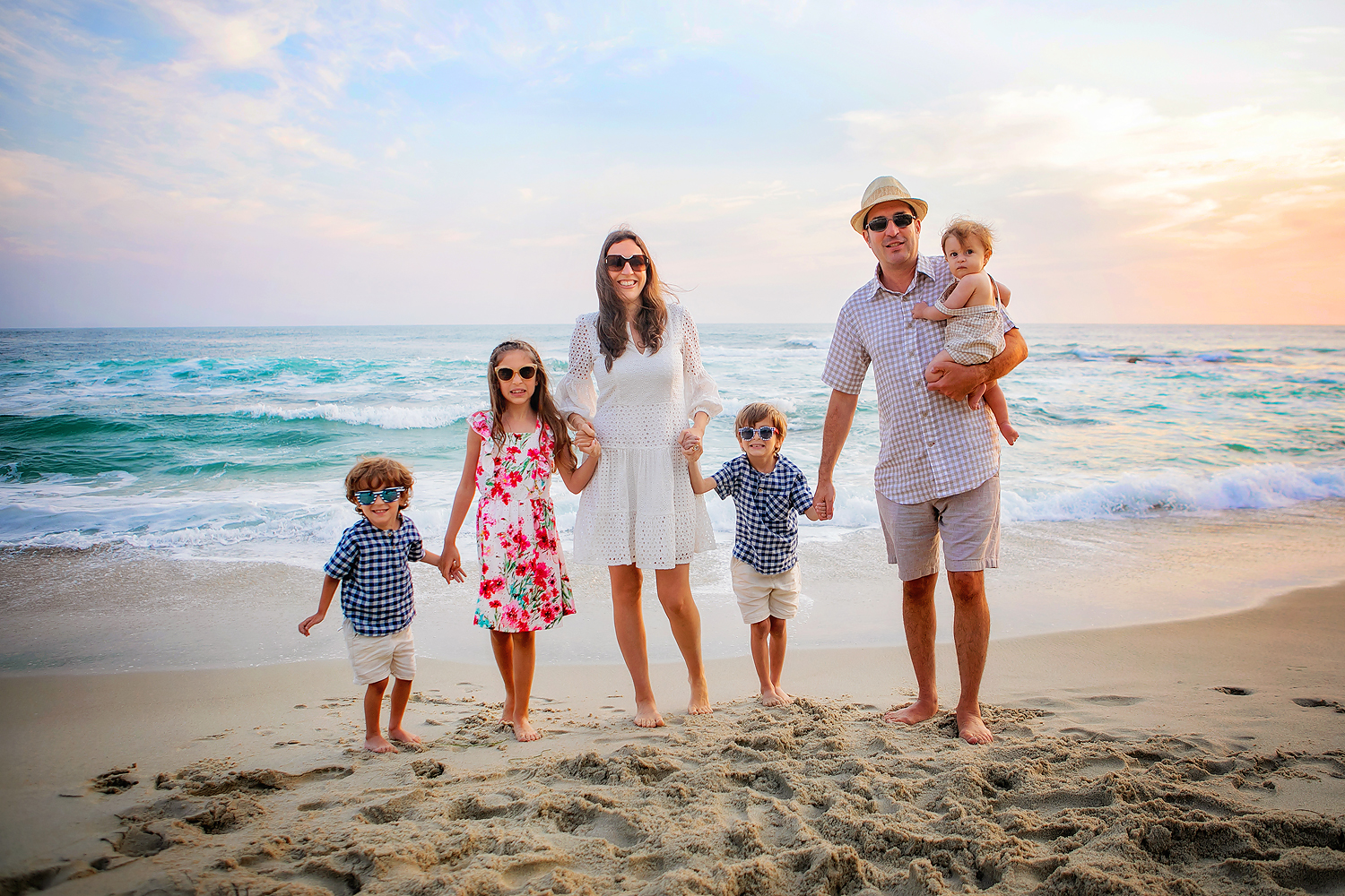 Photography by San Diego Family Photographer. Photo is of 6 people standing outdoors.