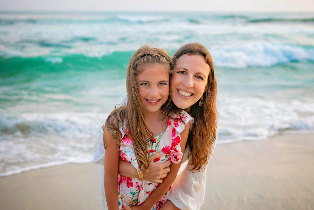 Photography by La Jolla Family Beach Photographer. Photo is of 2 people standing outdoors. 