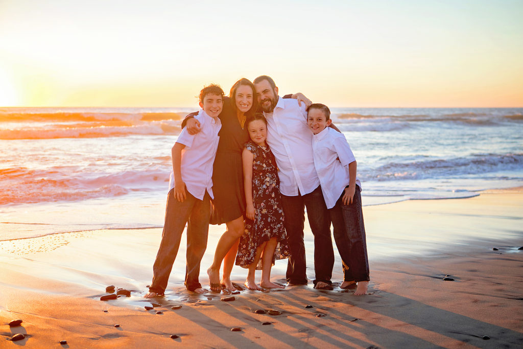 Photography by San Diego Family Beach Photographer. Photo may be of 3 people standing outdoors. 