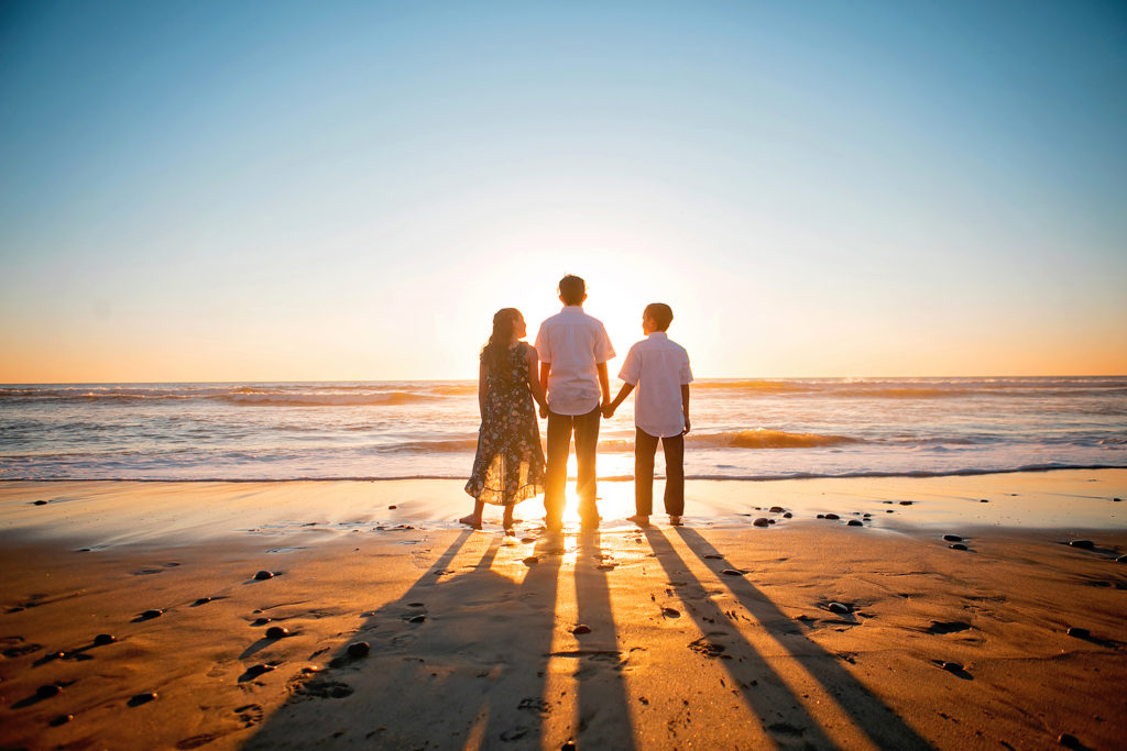 Photography at Carlsbad Beach. Photo may be of 3 people standing outdoors.