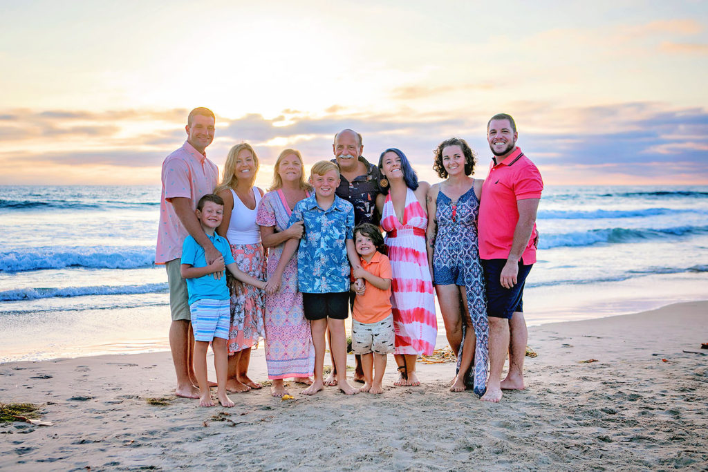 Photography by Extended family Beach photographer. Photo is of 5 people standing outdoors. 