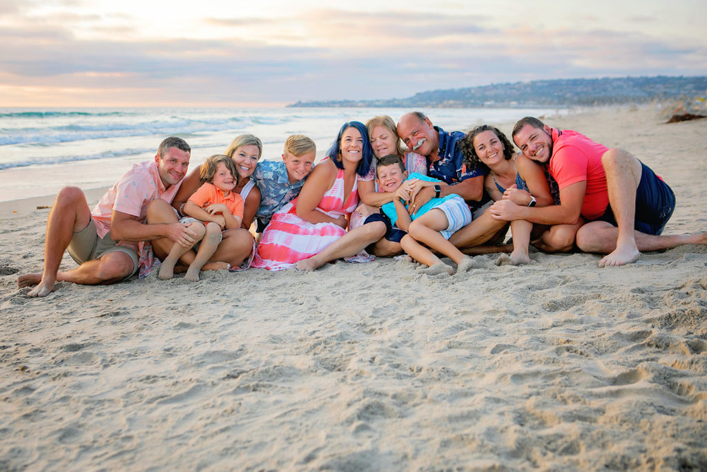 Photography by Extended family Beach photographer. Photo is of 5 people standing outdoors. 