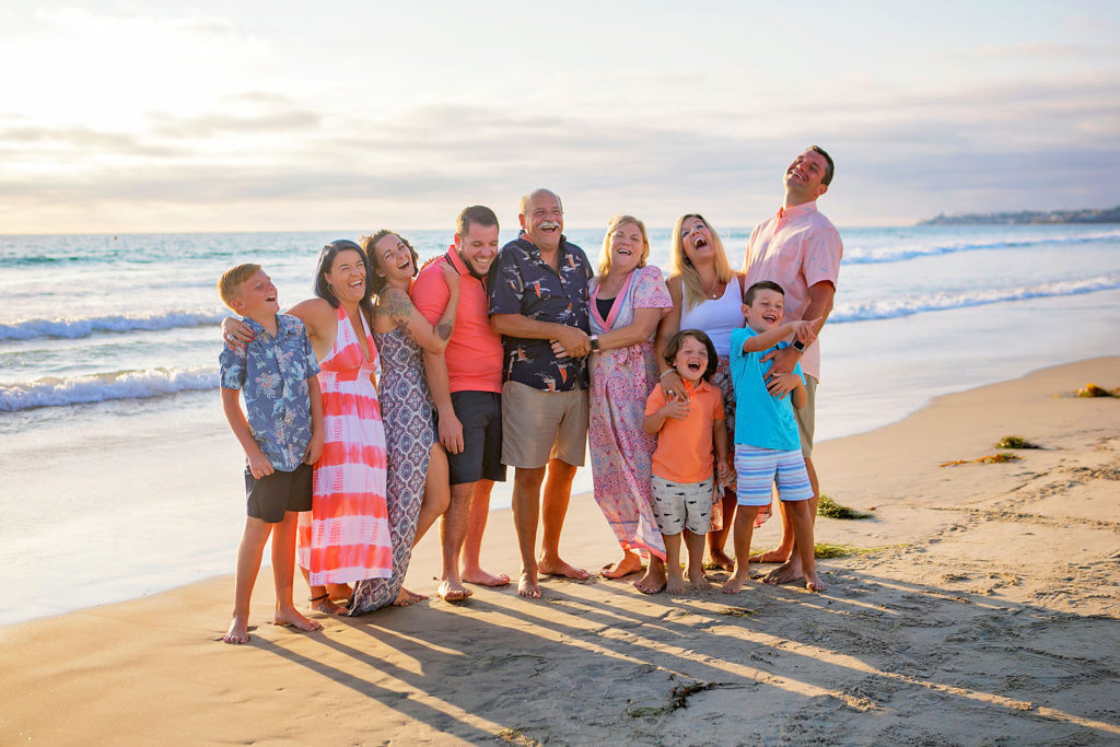Photography by Extended family Beach photographer. Photo is of 10 people standing outdoors. 