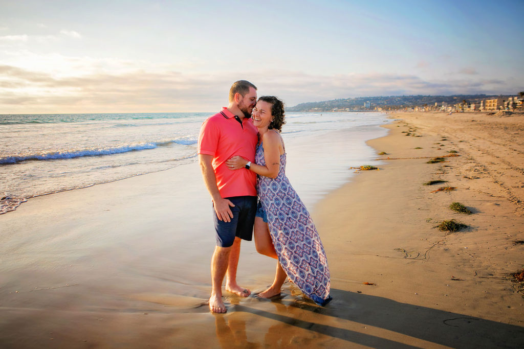 xPhotography by Couples Beach photographer. Photo is of 2 people standing outdoors. 