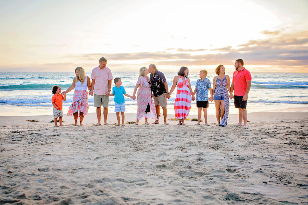 Photography by Extended family Beach photographer in San Diego. Photo is of 10 people standing outdoors. 