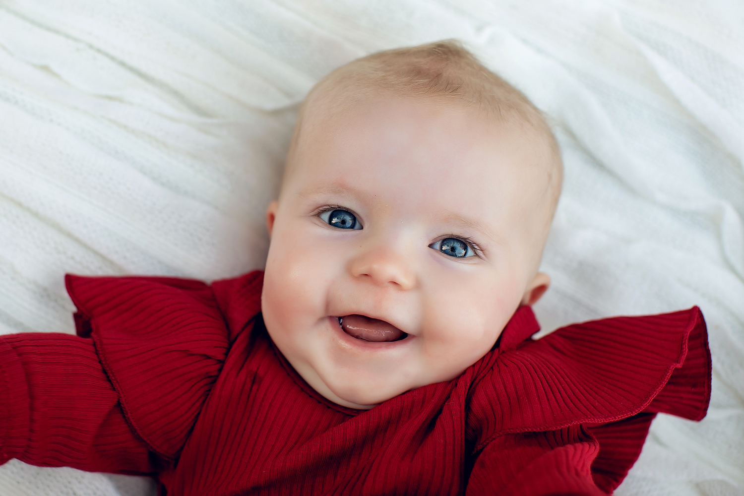 Photo of Baby Smiling for her Portrait Session in San Diego, CA with Kristin Rachelle