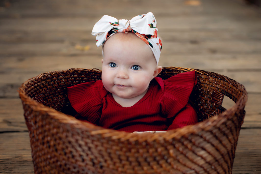 Photo of Baby Smiling for her Portrait Session in San Diego, CA with Kristin Rachelle 