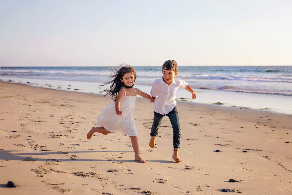 Childrens portrait of young siblings for their photo session on Carlsbad Beach with Kristin Rachelle Photography