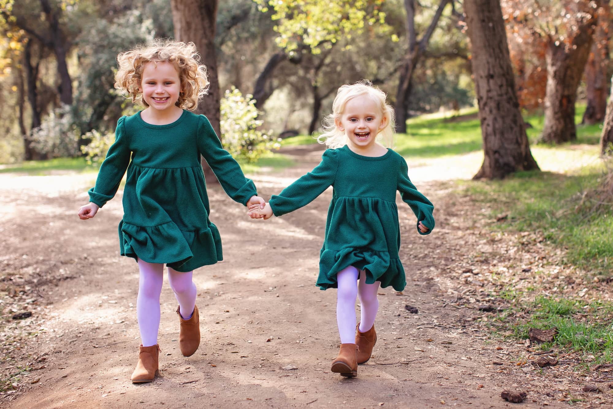 Girls running for their family portrait session with Kristin Rachelle Photography