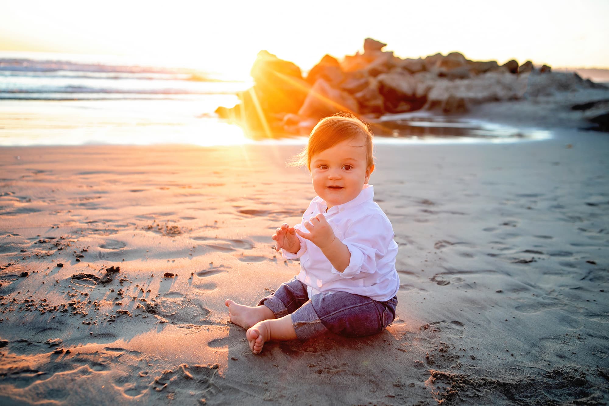 Baby on the beach at sunset for his pictures with Kristin Rachelle Photography