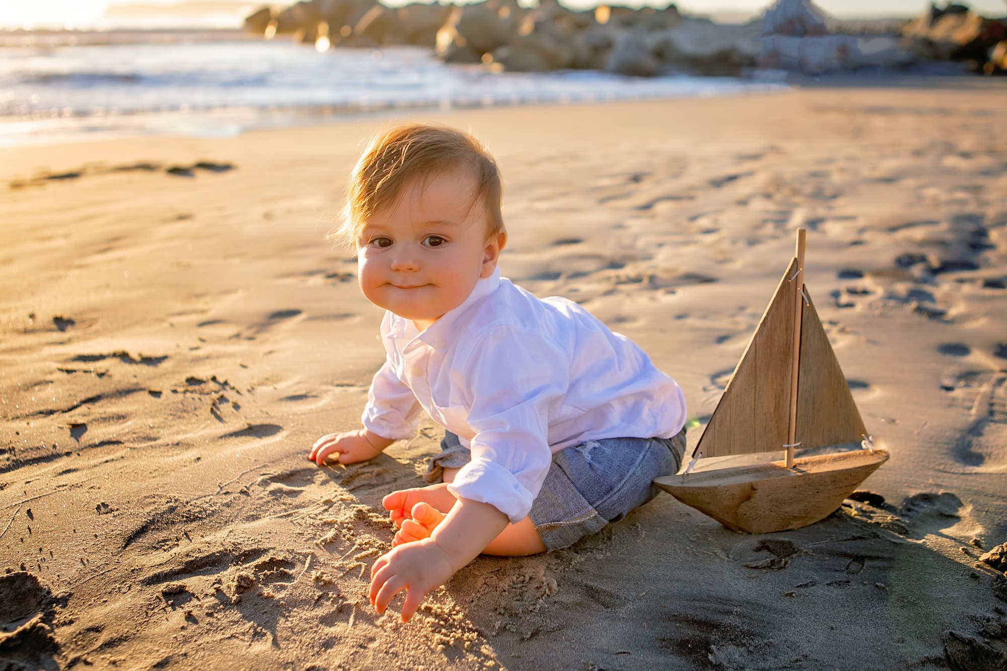 Baby on the beach at sunset for his pictures with Kristin Rachelle Photography