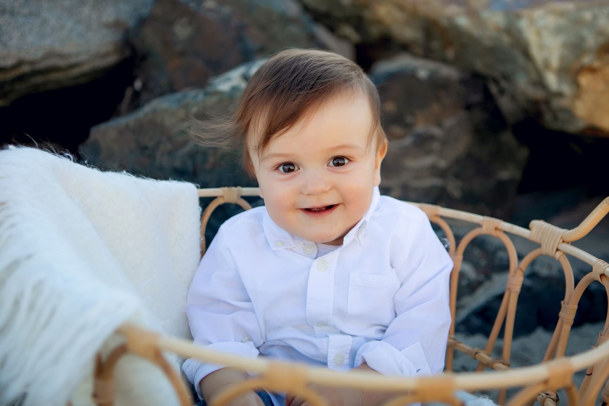 Baby on the beach in basket at sunset for his pictures with Kristin Rachelle Photography