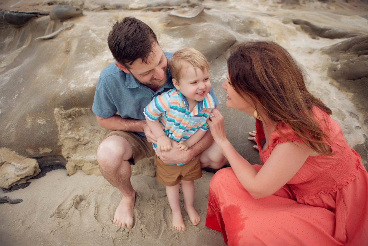 Beach Photography San Diego of baby with mom and dad at La Jolla Beach 