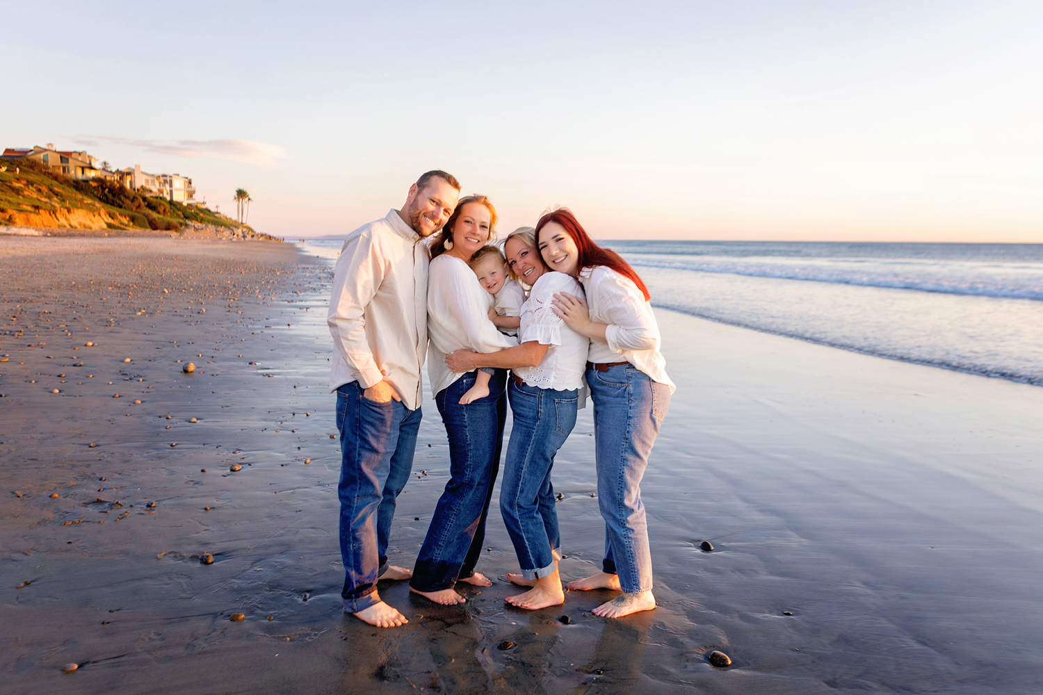 carlsbad family photographer wind in hair candid moment